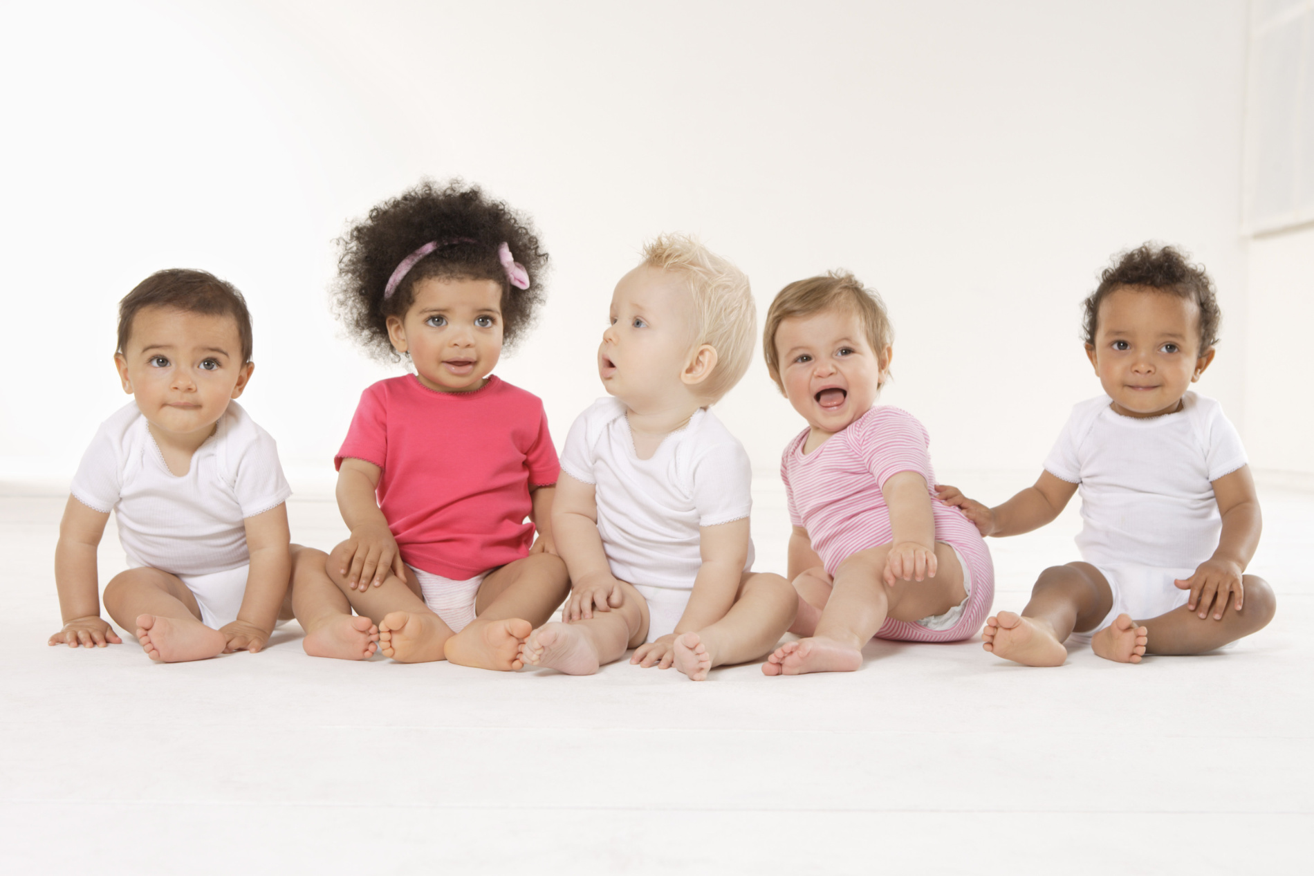 Group,Of,Babies,Sitting,On,Floor